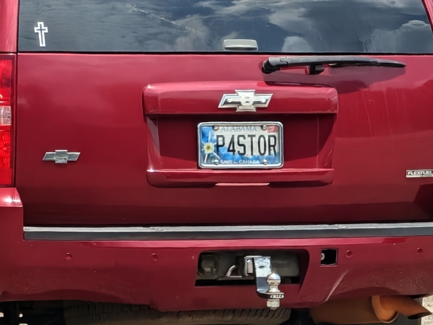 Vanity plate on a red SUV that says "P4STOR"
